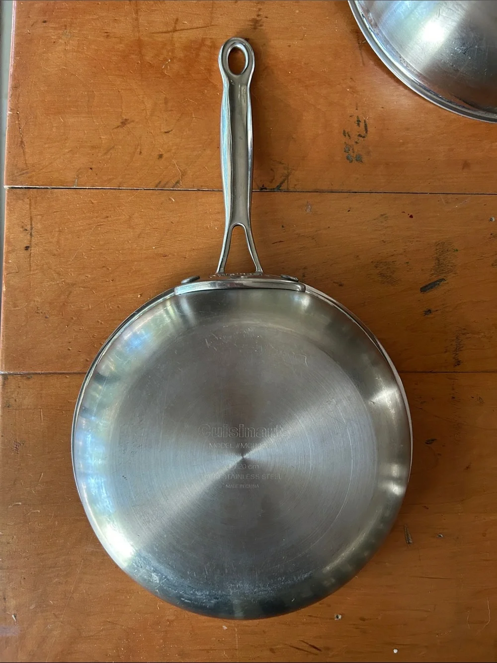 set Cuisinart Chef's Classic stainless steel skillets riveted handles.